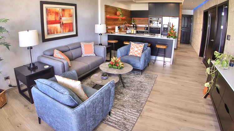 Open-plan living room of an ocean-view condo in Playa Flamingo