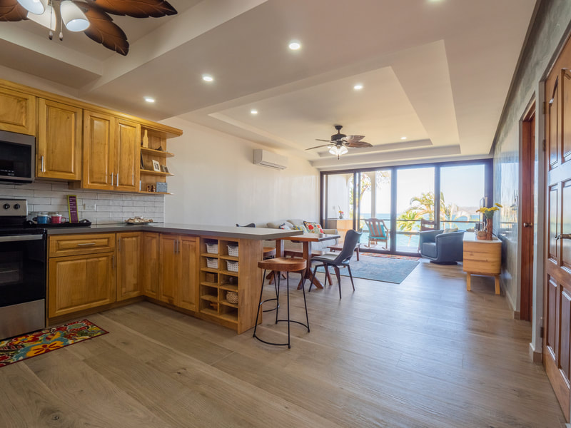 Open-plan living and kitchen with ocean view, Condo 611